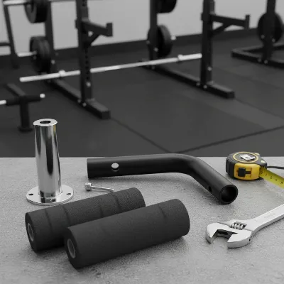 Key components of a DIY leg developer attachment, including rollers, weight post, and connection point, ready for assembly onto a weight bench.